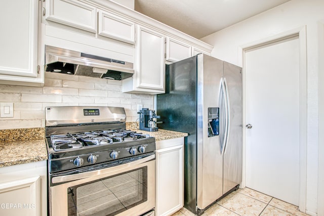 kitchen with tasteful backsplash, light stone countertops, appliances with stainless steel finishes, white cabinets, and light tile patterned flooring