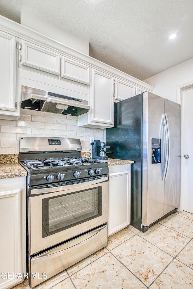 kitchen featuring decorative backsplash, white cabinetry, stainless steel appliances, and under cabinet range hood