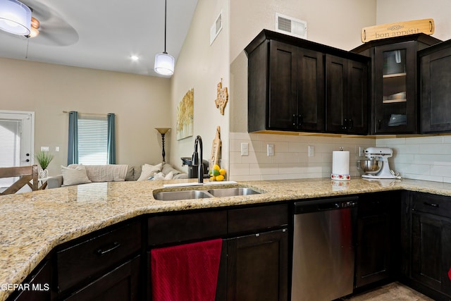 kitchen with a sink, visible vents, open floor plan, stainless steel dishwasher, and glass insert cabinets