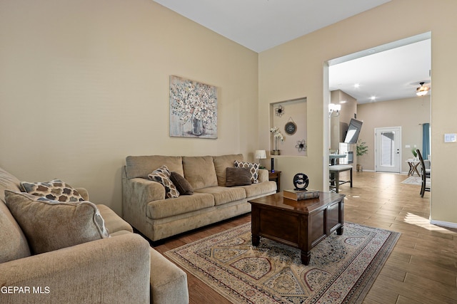 living room featuring baseboards and wood finished floors