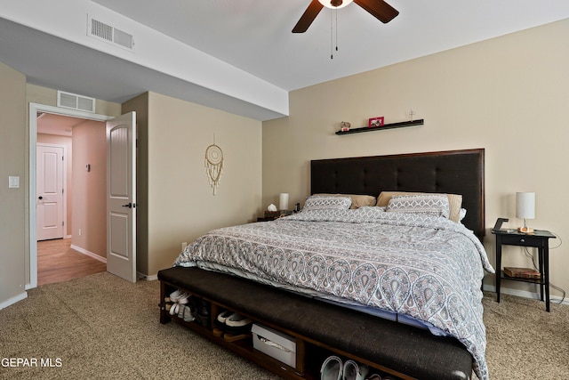 bedroom with baseboards, ceiling fan, visible vents, and carpet flooring