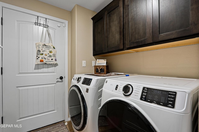 laundry area featuring cabinet space and washer and clothes dryer