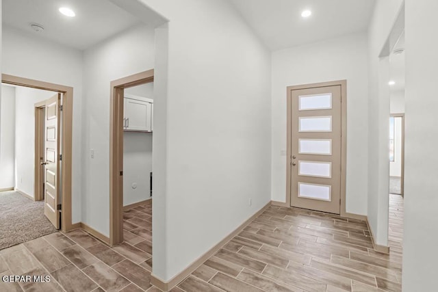 foyer entrance featuring baseboards, recessed lighting, and wood tiled floor