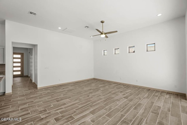 spare room with visible vents, wood finish floors, a ceiling fan, and recessed lighting