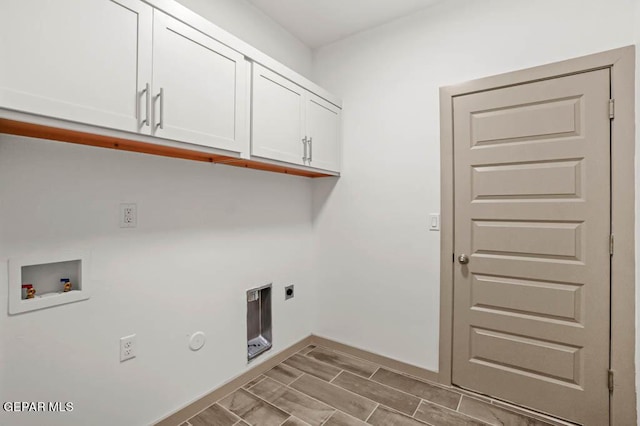 clothes washing area with cabinet space, baseboards, washer hookup, and hookup for an electric dryer