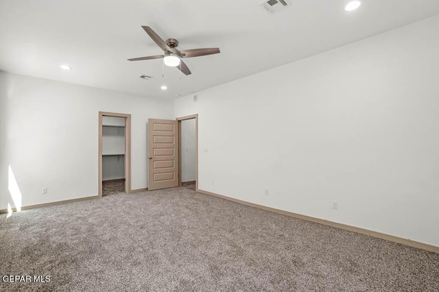 unfurnished bedroom with carpet floors, recessed lighting, visible vents, and baseboards