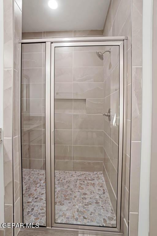 bathroom with a stall shower