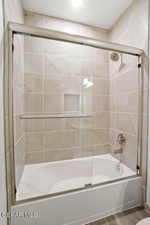 full bathroom featuring enclosed tub / shower combo