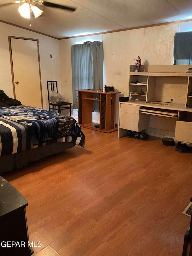 770 Eagles Den Ln, El Paso, TX 79927 - bedroom with light wood-type flooring, ceiling fan, and crown molding