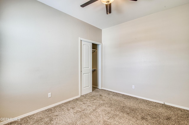 unfurnished bedroom featuring a closet, light carpet, ceiling fan, and baseboards