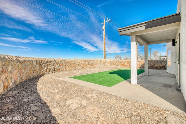 view of yard with a patio area and a fenced backyard