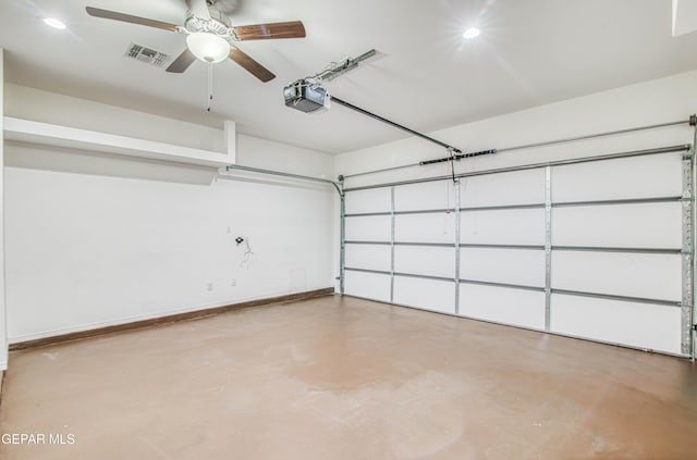 garage featuring a garage door opener, visible vents, baseboards, and a ceiling fan