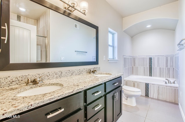 full bathroom with tile patterned flooring, a garden tub, a sink, and double vanity