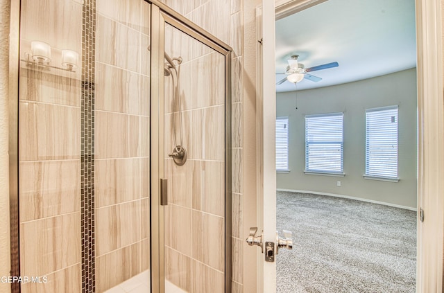 full bath featuring a shower stall and a ceiling fan