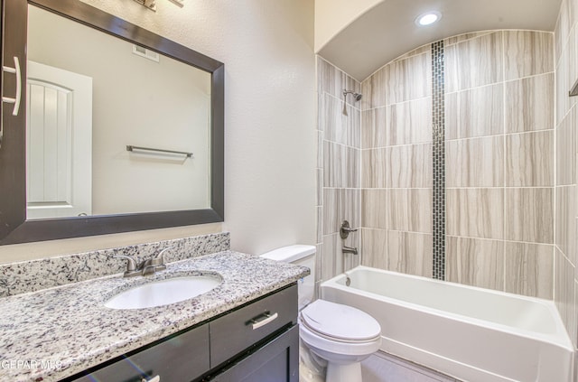 full bathroom featuring  shower combination, vanity, and toilet