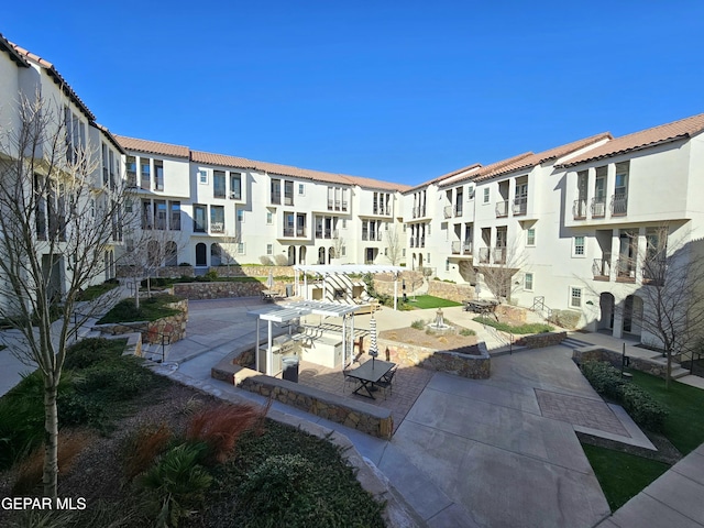 view of home's community featuring a patio