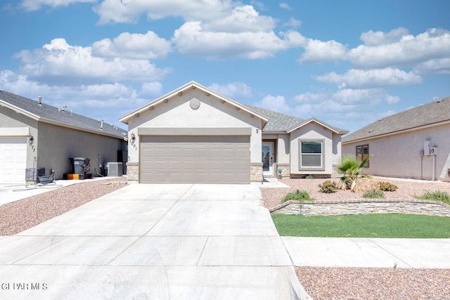 ranch-style house with a garage, concrete driveway, stone siding, central AC, and stucco siding