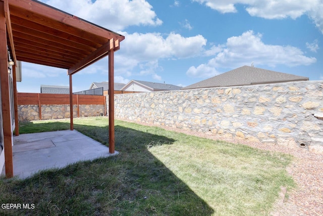 view of yard featuring a patio and a fenced backyard