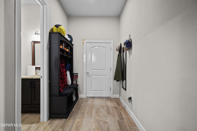 interior space featuring light wood finished floors and baseboards