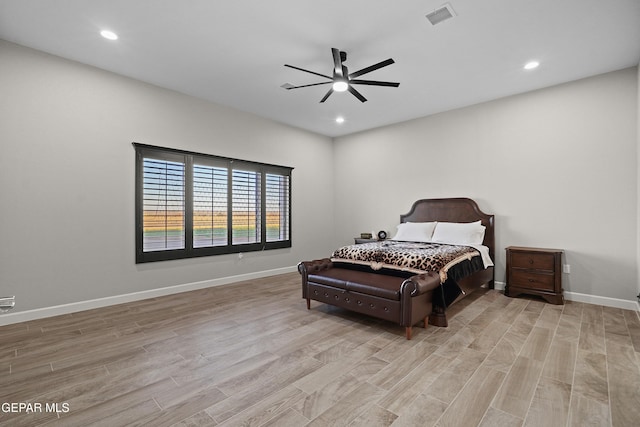 bedroom featuring light wood finished floors, recessed lighting, visible vents, and baseboards