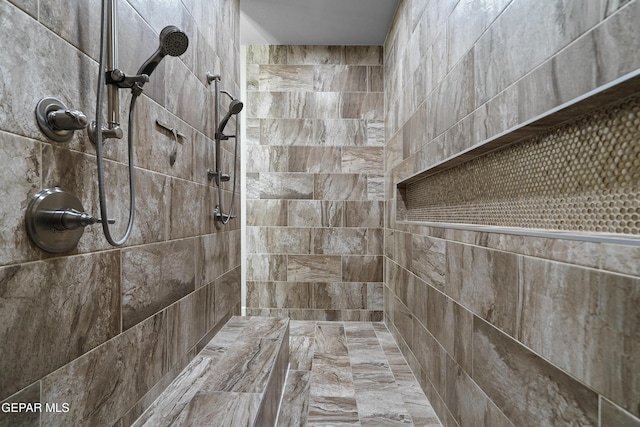 full bathroom with a tile shower