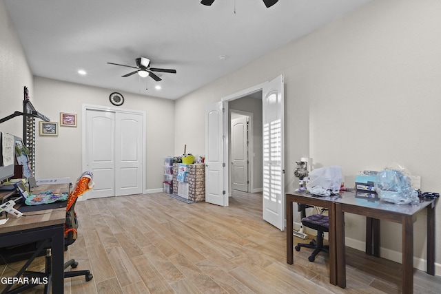 office space featuring light wood-style floors, recessed lighting, ceiling fan, and baseboards