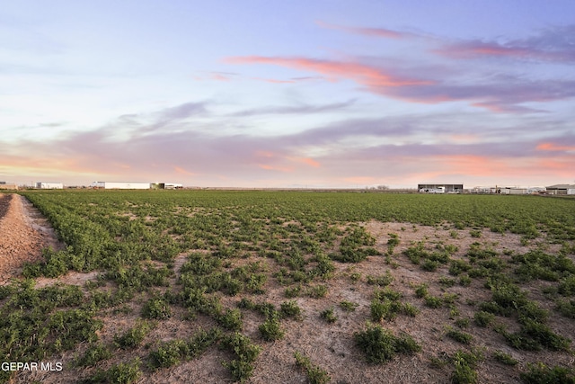 nature at dusk featuring a rural view