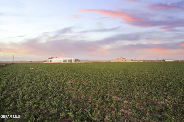 nature at dusk featuring a rural view