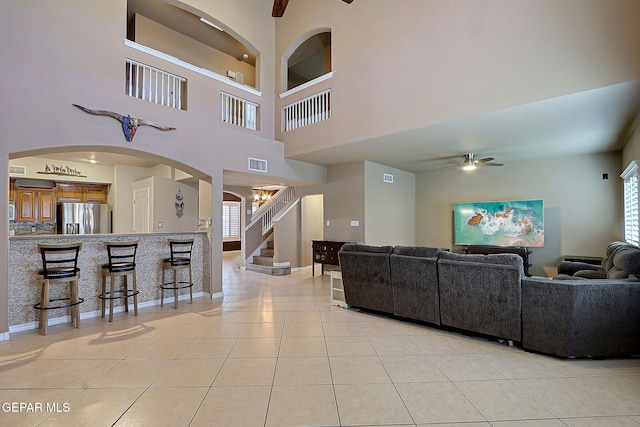 3537 Tierra Bahia Dr, El Paso, TX 79938 - living room with a wealth of natural light, visible vents, stairway, and light tile patterned floors
