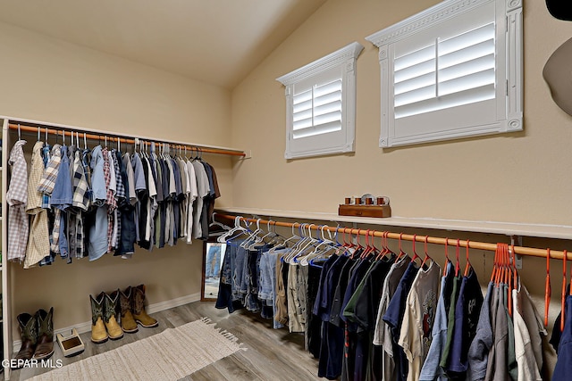 3537 Tierra Bahia Dr, El Paso, TX 79938 - walk in closet with lofted ceiling and wood finished floors