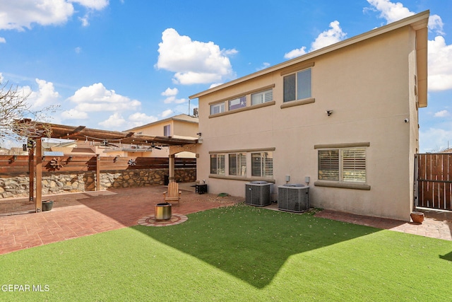 3537 Tierra Bahia Dr, El Paso, TX 79938 - back of house featuring a patio, fence, central AC, and stucco siding