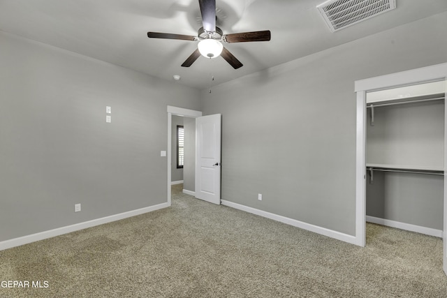 unfurnished bedroom featuring carpet floors, baseboards, and visible vents