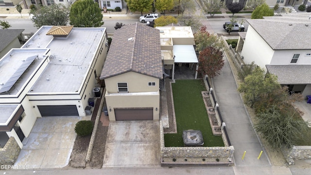 birds eye view of property with a residential view