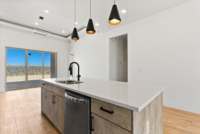 kitchen featuring a center island with sink, light countertops, a sink, and stainless steel dishwasher