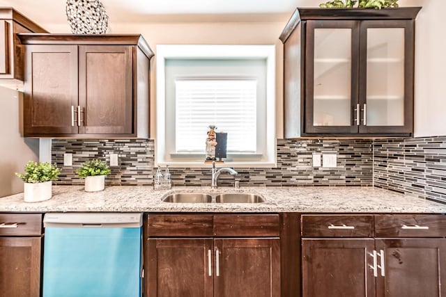 14291 Armando Silva Dr, El Paso, TX 79938 - kitchen with glass insert cabinets, dishwasher, a sink, and tasteful backsplash