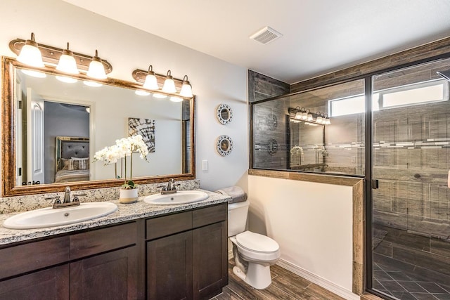 14291 Armando Silva Dr, El Paso, TX 79938 - full bathroom with a stall shower, visible vents, a sink, and ensuite bathroom