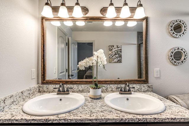 14291 Armando Silva Dr, El Paso, TX 79938 - full bathroom featuring double vanity and a sink