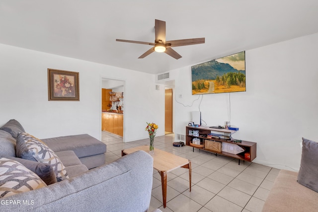 living room with light tile patterned floors, ceiling fan, and visible vents