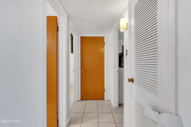 hall with light tile patterned floors