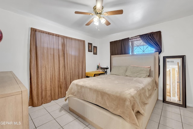 bedroom featuring a ceiling fan and light tile patterned floors