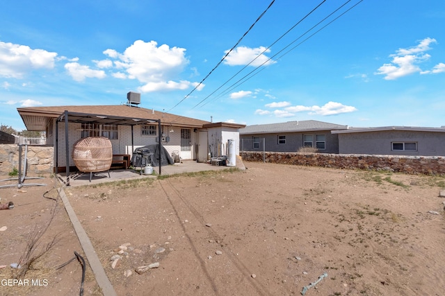 rear view of house with brick siding