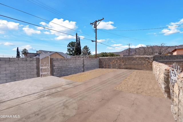 view of yard featuring a fenced front yard and a gate