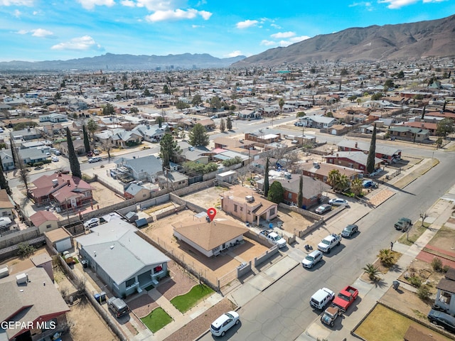 birds eye view of property with a residential view and a mountain view