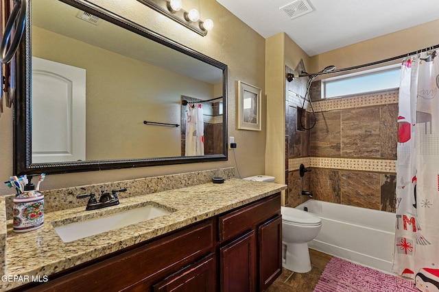 full bathroom featuring toilet, shower / bath combo, vanity, and visible vents