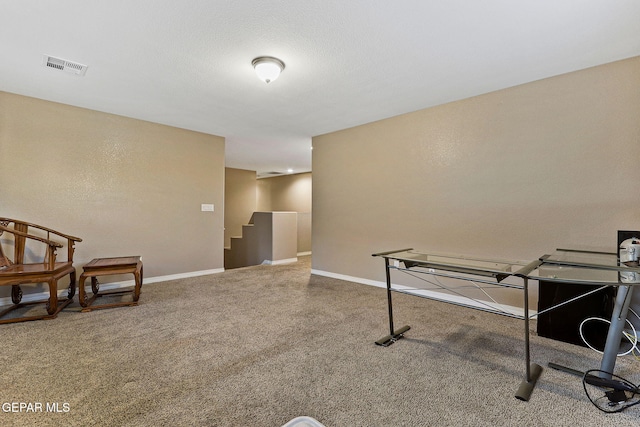 game room featuring a textured ceiling, carpet flooring, visible vents, and baseboards