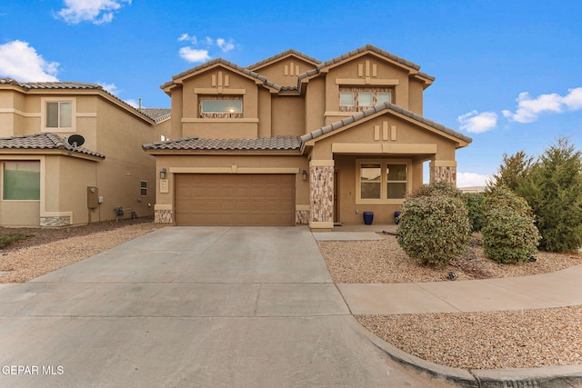 view of front facade with an attached garage, stone siding, concrete driveway, a tiled roof, and stucco siding