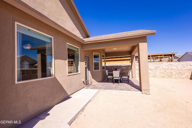 view of patio / terrace featuring fence