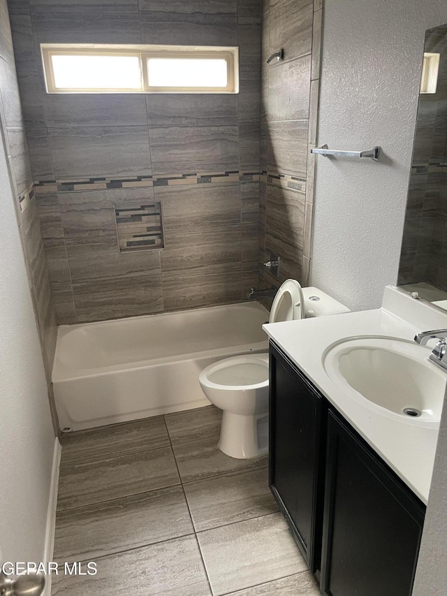 full bathroom with shower / bath combination, toilet, a wealth of natural light, and vanity