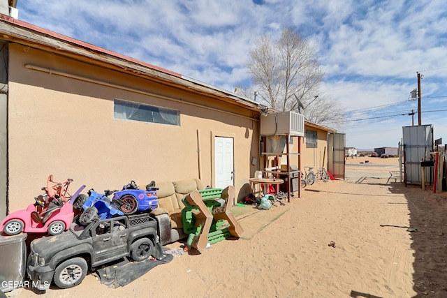 view of side of home featuring stucco siding