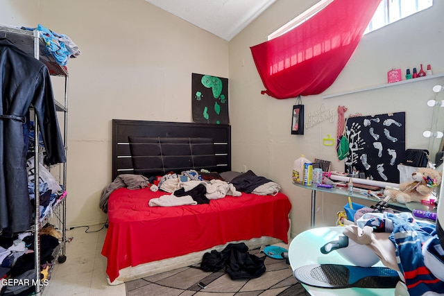 bedroom featuring vaulted ceiling